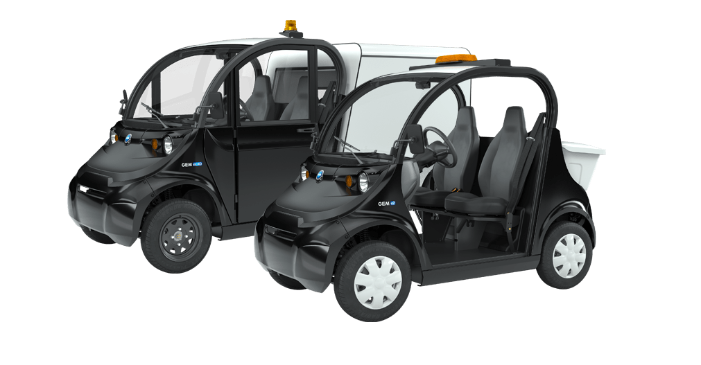 two side by side black electric vehicles