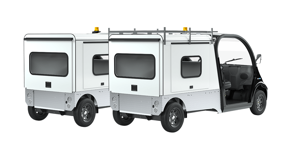 GEM white utility vehicles with rear carriers