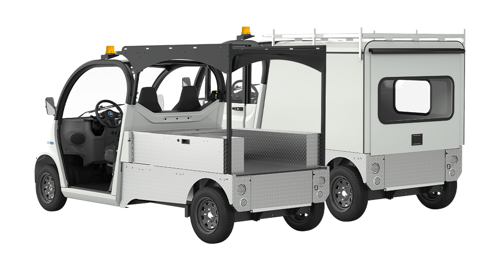 Two side by side white electric vehicles one with an open cab and one with a closed cab