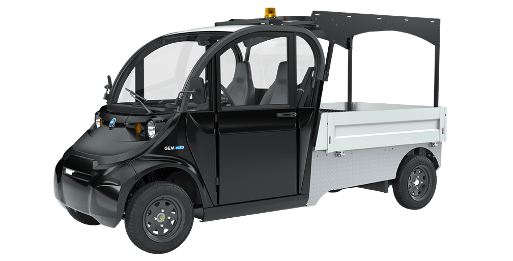 A black and white electric vehicle with open cab