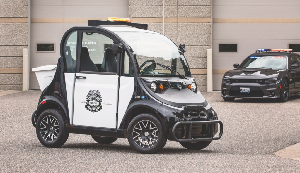 An electric vehicle with police emblem on the door