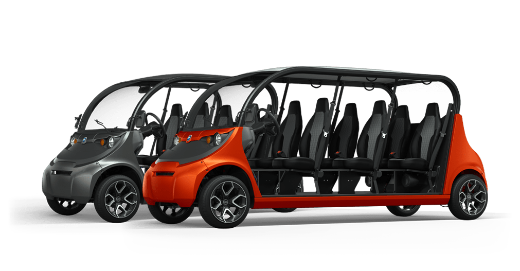 Two side by side 6 seater electric vehicles, one red and one black