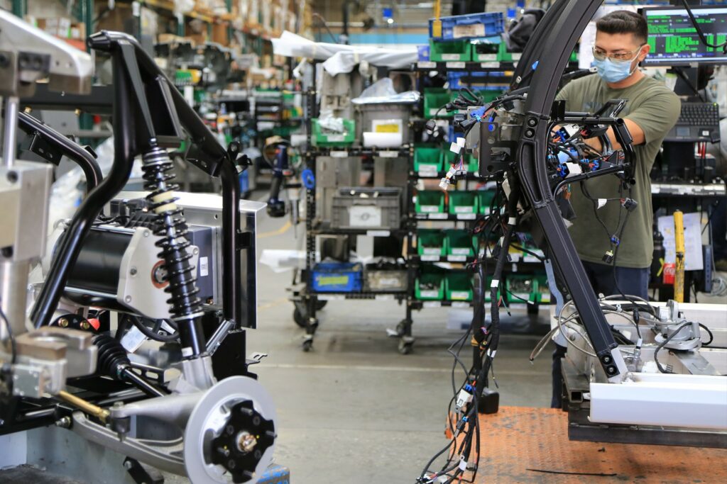 Waev team member building GEM electric vehicle frame in Anaheim, California manufacturing facility